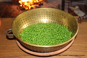 After the peas have been boiled enough for the receipt (recipe) Green Peas Tart drain them.  Pictured is the reproduction brass colander that I used to drain the peas.