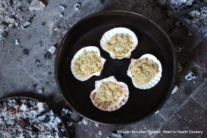 After the receipt (recipe) Stewed Salsify was put in scallop shells, the filled shells were placed in a bake kettle and baked on a burner of embers and with embers on the lid to create an oven.